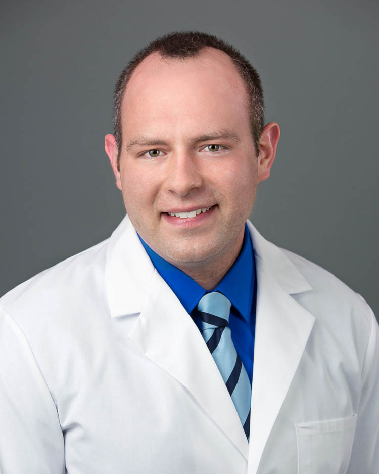 Retrato del Dr. Chris Hock, dentista profesional de Absolute Dental.